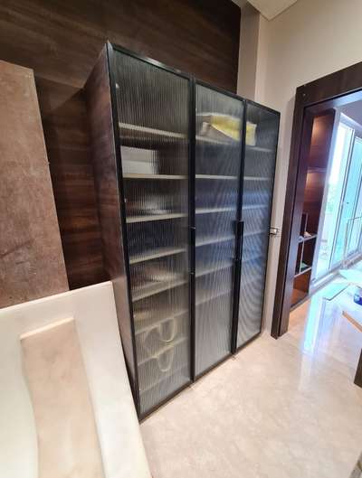 Modular sliding wardrobe with Fluted Glass.