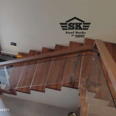 wood and glass handrail 
 #Kollam  #kollamdesigner  #construction_company_in_kollam  #kollamdiaries  #kollambuildingdesign  #kollamvibes  #trivandrum  #trivandrumhome  #scorio_lights_trivandrum  #trivandruminteriors  #trivandrumarchitects  #trivandrumhome