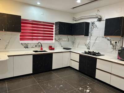 Modular kitchen with black marble finish glittering door and white glossy shutters. # modular kitchen
