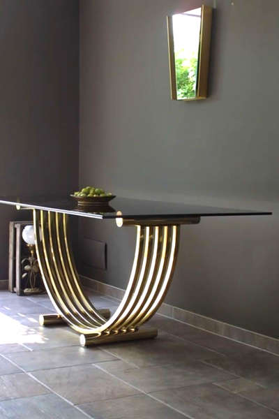 stainless steel table with brass finish glass top