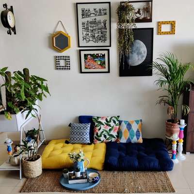 Get this desi boho look with colourful floor cushions topped with printed cushions to make a comfy seating corner, add a jute rug and frame it with planters on either side. Decorate your wall with frames a plenty and invest in a niche vintage clock.
#interior #decor #ideas #home #interiordesign #indian #colourful #decorshopping
