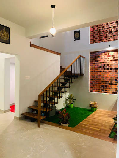 Courtyard with staircase design
.
.
Approx cost : 2.2lkh including staircase,tile work and jali work both material and labour
.
.
 #SteelStaircase #courtyardindoor #jalidesign #residentialinteriordesign #keralahomedesignz #IndoorPlants #industrialdesign