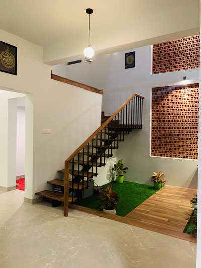 Courtyard with staircase design
.
.
Approx cost : 2.2lkh including staircase,tile work and jali work both material and labour
.
.
 #SteelStaircase #courtyardindoor #jalidesign #residentialinteriordesign #keralahomedesignz #IndoorPlants #industrialdesign