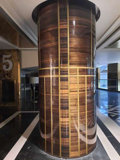 a this is Veneer ply round column with high gloss PU Polish with concelled Gold Metal strip at gurgoan