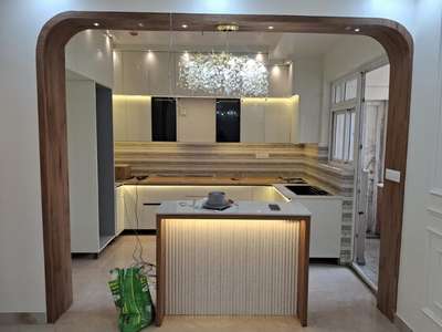 Modular Kitchen and TV Unit by Huda Interior.  #interiordesign