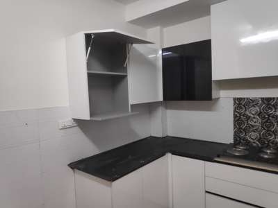U shape simple low budget Kitchen area 10×08 yard white colour black stone