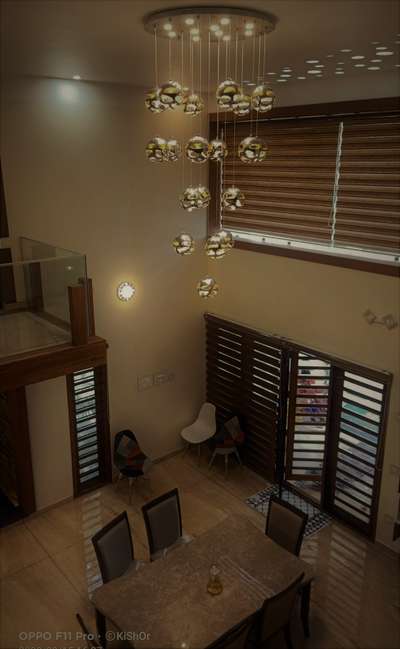 Dinning area* seen below*Double height #dinning  #interiordesignkerala  #lights