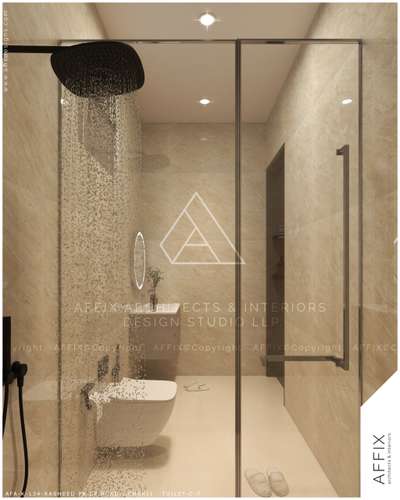 A refined contemporary bathroom designed with warm beige stone finishes and a clean, minimal palette. The frameless glass shower enclosure with a matte black rain shower creates a sleek focal point, complemented by concealed fittings and a wall-mounted sanitary fixture. Soft recessed lighting and subtle reflections enhance the sense of space, delivering a calm, spa-inspired experience through thoughtful material selection and detailing. #Architect  #architecturedesigns  #Architectural&Interior  #architecturekerala  #kerala_architecture  #bathroomdesign