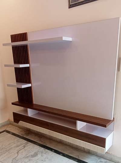 High gloss laminated TV cabinet for enhanced wall look. made in 18 mm Plywood for durability