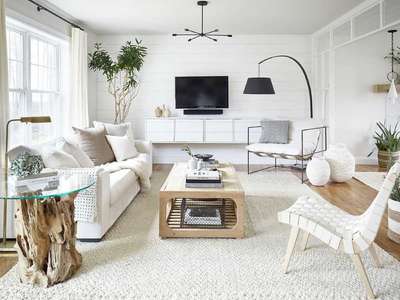 Have a look at this chic minimalistic pure white design for a scandinavian touch. Try light coloured wooden furniture to add to the peaceful look, monochromatic cushions in beige, white and gray add texture to the space. A contrasting black lamp adds depth along with the subtle black central light fixture in a modern design.
#interior #decor #ideas #home #interiordesign #indian #colourful 
#decorshopping