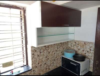 kitchen cupboards with glass 
 #glassworks 
white and maroon detailing