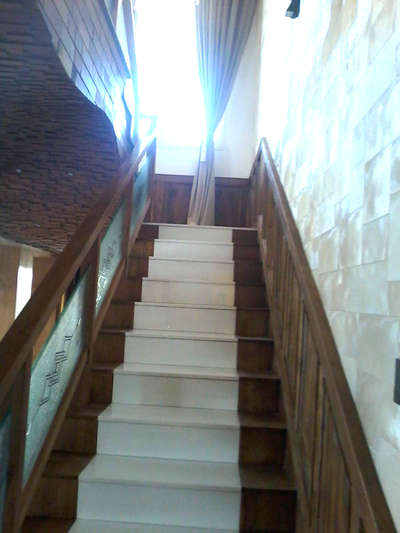 #StaircaseDesigns #WoodenStaircase #wallpanneling 
#teakpannelingstair  #Ernakulam 
Nano White with teak wood panneling.