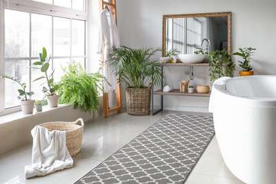 Create a white themed modern bathroom with patterned rug, green plants, wicker baskets and some sustainable decor.#interior #decor #ideas #home #interiordesign #indian #colourful#decorshopping