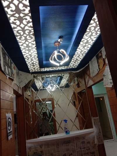 Cnc MDF false ceiling with wall paper nd pu polish.