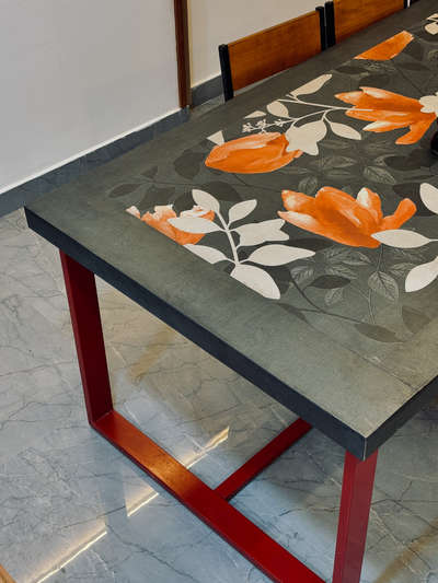 Project type: Interior design and Execution
Location: Pangappara, trivandrum
The Red Thread-
This residential interior project harmoniously blends industrial strength with tropical calm, centered around a unique visual element — red steel bars that subtly connect every custom-built furniture piece. The bold red becomes the common thread weaving through a cohesive narrative of design, linking the sofa, dining table, TV unit, and storage systems into a singular visual language.
Natural textures like walnut wood laminates, botanical graphic wall panels, and ceramic printed dining surfaces contrast beautifully with the industrial robustness of steel, softening the palette with warm beige upholstery and intricate tilework at the wash zone.
Architectural details such as curved wood-clad ceilings, arched niches, and ambient lighting elevate the spatial experience while maintaining minimalism and clarity in function. The space seamlessly balances artistry with utility, presenting a bold, modern yet nature-inspired aesthetic  #KitchenInterior #homeimprovement  #homeinterior  #LivingRoomTable  #LivingroomDesigns #KitchenInterior  #minimalistichome