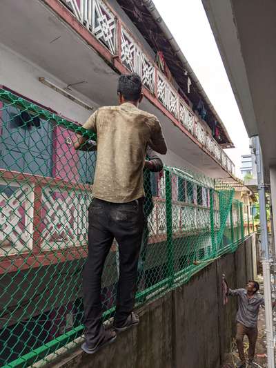 ongoing work, Chainlink fence on compound wall.