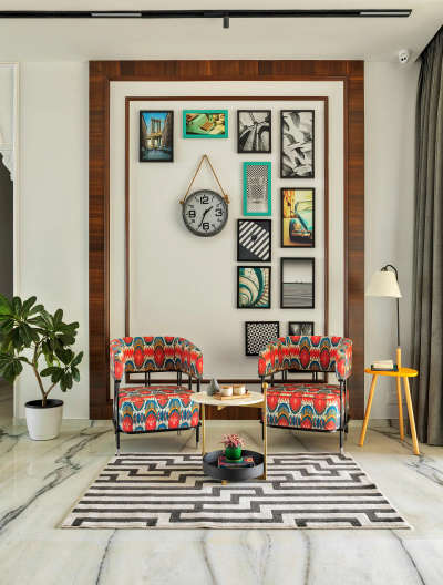 Choose simple, crisp and straight-lined furniture, beautiful white pot and a number of art frames to create this artistic and clutter-free living room. Add a vintage hanging clock and colourful chairs to offset the neutral colour pallette.
#interior #decor #ideas #home #interiordesign #indian #colourful #decorshopping