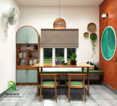 Cozy dining nook with a wooden table, green-cushioned chairs, bench seating by the window, vintage crockery display, and warm accents 🌿🍽️

Client : Rehana Manoj 
Area   : Dining Area