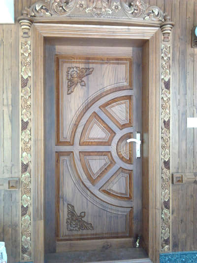 #divinecarpentry 
teak wood front door