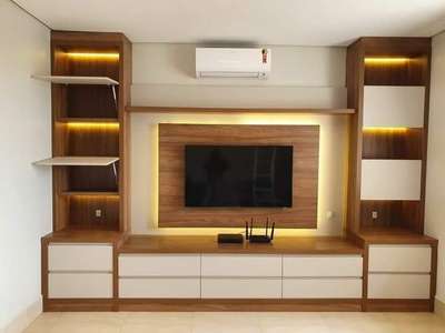 *TV Units *
Providing And Fixing of TV Units Made of18mm 
thick.HDHMR Commercial/HDHMR Pre-laminated 
and Internal sholl be finished with 0.8mm Laminate & 
outer face shall be 1.0mm thick. laminate,Laminate as 
per required. The TV Units Carcase & Doors edges sholl 
be covered with PVC tape with Drawer, channel and 
hinges fittings of Hettich /Ozone/Firewall. and complete 
in all respects.
Quotation According to Exisiting TV Unit Sizes and 
TV Unit Size is grows up then amount is change.