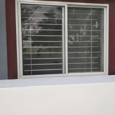 Ivory track with clear glass and mosquito net windows .  #SlidingWindows ,  #mosquitonet ,  #indorecity  #