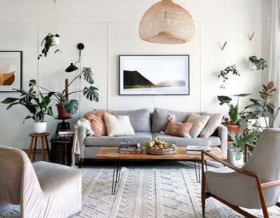 Throwing a mixture of neu trals throughout your home can give your humble abode a very calm and earthy vibe. Try combining soft gray sofa with a simple wooden coffee table and cushions in shades ranging from ivory to rust. Add a rattan pendant light and lots of plants, both hanging and potted as the main attraction to your room. #interior  #decor  #ideas  #home  #interiordesign  #indian  #colourful #decorshopping