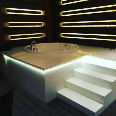 Round jacuzzi with designer platform.