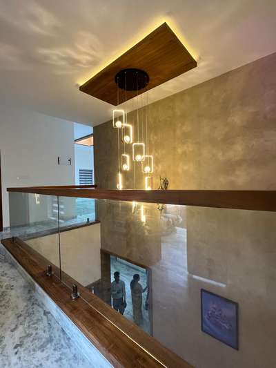 Seen below , hangil lights ,glass hand rail with teak wood rail. #GlassHandRailStaircase  #hanginglight  #teakwood#