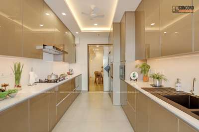 "Experience organized elegance with the sleek kitchen cupboards in Ms. Ruby's Cochin home! 🍽️✨ Designed with a 24 Lakhs budget, these storage solutions offer a perfect blend of style and functionality, enhancing the kitchen space across 2100 Sq.Ft. #KitchenCupboardChic #ElegantInteriors #CochinHomes #HomeDesign2019"
