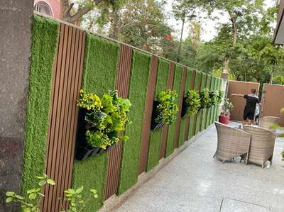 wpc exterior louvers with grass.