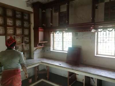 Open kitchen with teak wood on going