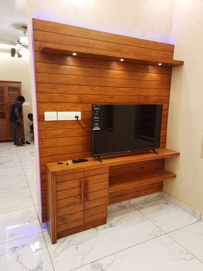 treated mahagony tv unit, marasala interiors and architects