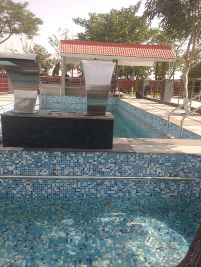 tiles work in swimming pool in lampur farmhouse