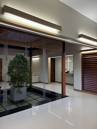 A warm, contemporary interior crafted with a strong architectural sensibility—defined by clean lines, muted tones, and seamless spatial flow. The open-plan layout connects dining and living areas effortlessly, enhanced by soft natural light and refined material layering. Subtle wood accents, custom detailing, and minimal surface treatments create a calm, sophisticated atmosphere tailored for everyday comfort.
This residence was developed in collaboration with PCA, combining thoughtful interior planning with a restrained, modern aesthetic.
2800 sqft | Client: Sibi | Location: Amboori, Trivandrum
#InteriorArchitecture #ContemporaryInteriors #ModernResidence #ArchitecturalDesign #OpenPlanLiving #MinimalInteriors #DesignDetails #TrivandrumHomes #koloprojects