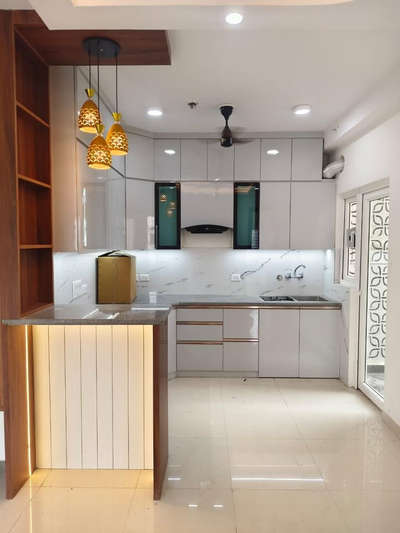 New Modular Kitchen Interiors!
.
.
.
.
 #HomeDecor  #HouseRenovation  #InteriorDesigner  #LShapeKitchen  #KitchenCabinet  #KitchenInterior  #Best_designers  #archtecturaldesign   #greaternoidawest  #samridhiapartment  #newprojectdone  #kitchen123 #breakfastcounter #LUXURY_INTERIOR #FlooringServices