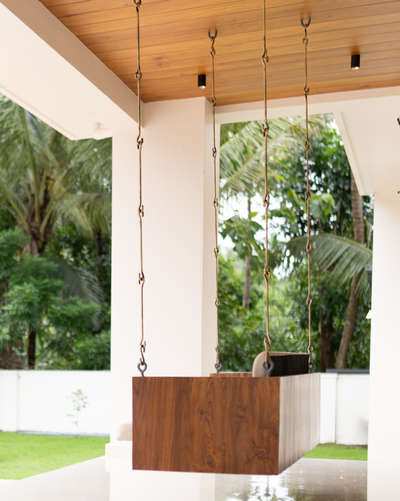 “Enjoying the peaceful vibes with this cozy wooden swing in the perfect outdoor spot 🌿☀️ Nothing like relaxing amidst nature and fresh air!” #Kozhikode  #InteriorDesigner  #Designs