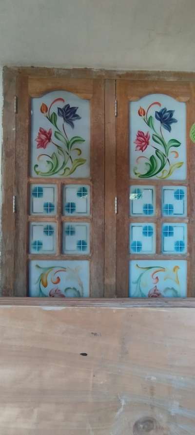 kerala glass design window 

#KeralaStyleHouse #WindowsIdeas #WoodenWindows