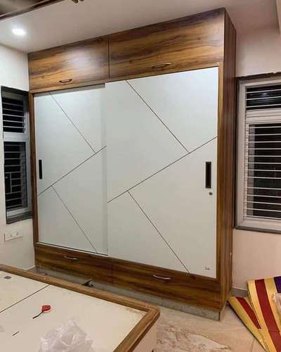 *Modular Wardrobe*
Wordrobe will be made by 18 mm ply
,inside mica.8 mm and outer mica 1mm 
outer moca will be green comp
Handle with 100 rs range and godrej hings will use,lock will godrej, channal also godrej