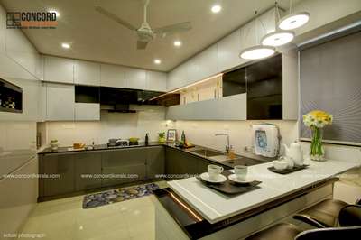 "Experience culinary elegance in Mr. Aaron Xavier's kitchen! 🍳✨ Designed with precision and style on a 19 Lakhs budget, this space marries functionality with aesthetic appeal across 2200 Sq.Ft. #KitchenGoals #ElegantDesign #CochinHomes #Throwback2018"