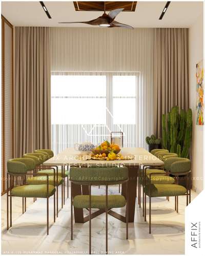A contemporary dining space designed with earthy tones and modern aesthetics, featuring olive-green chairs, a sleek unique table, and soft natural lighting that enhances the warm, inviting ambiance. The touch of greenery and vibrant wall art adds freshness and character to the setting. #Architect  #architecturedesigns  #Architectural&Interior  #Architectural&nterior  #architectsinkerala  #kerala_architecture  #best_architect  #diningroomdecor