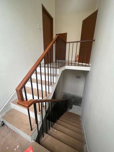 industrial with wood handrail finished stair