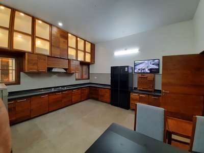 Teak wood finish kitchen
irinjalakuda