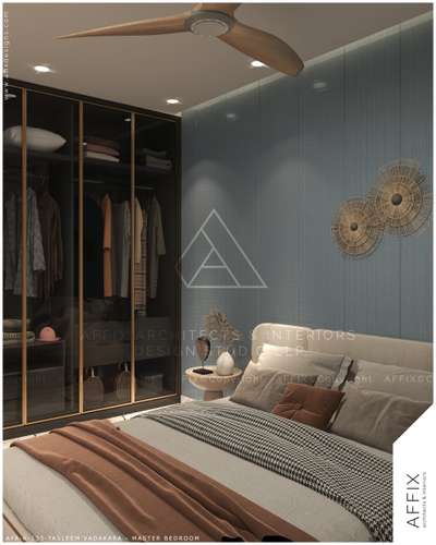 Serene blues meet warm neutrals! This master bedroom exudes sophistication with a textured blue accent wall, cozy layered bedding and sleek glass wardrobe detailing. A perfect blend of elegance and comfort for a dreamy retreat ! #Architect  #architecturedesigns  #Architectural&Interior  #kerala_architecture  #best_architect