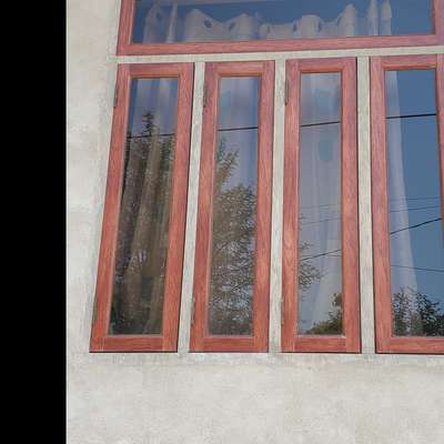 wooden coated aluminum window in brown glass in ss feeting.  #AluminiumWindows  #GlassDoors #WoodenWindows  #SlidingWindows   #aluminium