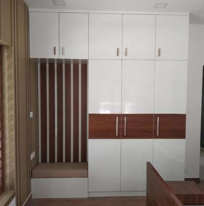 wardrobe with seating arrangements   #HouseDesigns  #BedroomDesigns