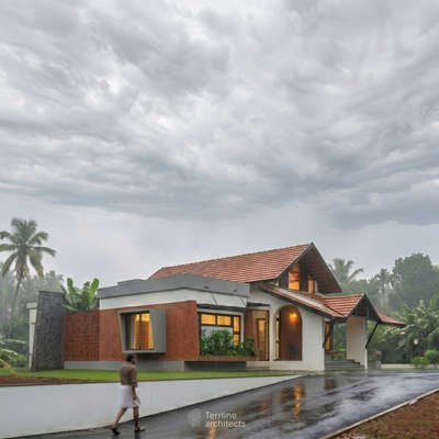 Proposed 3BHK Residence at Alakode
View 01
A tropical home shaped by climate and context—sloping roofs, deep sit-outs, and warm materials coming together to create a calm, breathable living experience 

#KeralaArchitecture
#tropicalarchitecture
#terracotta #randomrubble #indiandesign #fypppppppppppppppppppppppppppppppppppppppppppppppppppppppppppppppppppppp