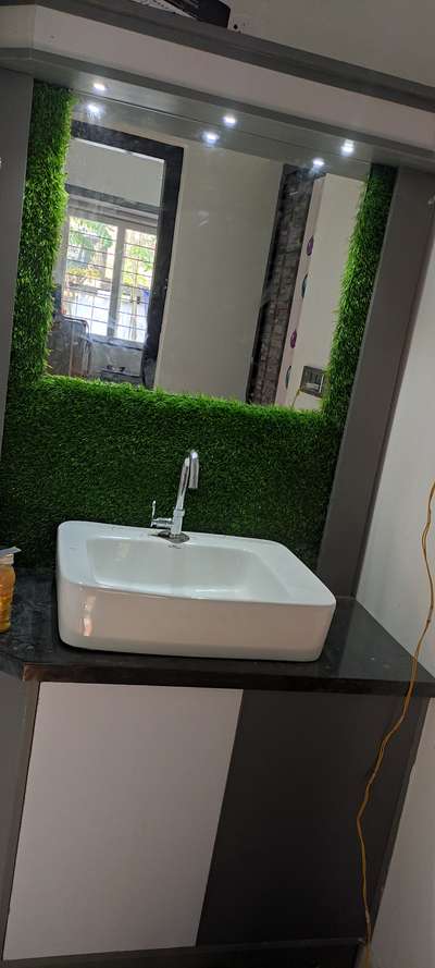 wash counter with artificial grass panelling  and T V  units

TRUE INTERIOR WORK CHERTHALA MOB  
HARI :8086136906
9061360193