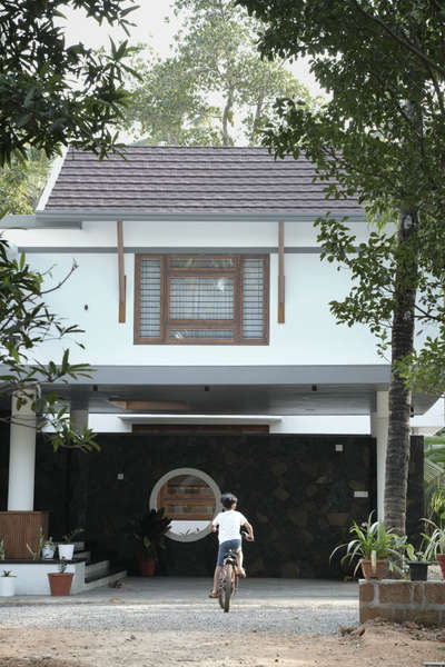 Completed Residence for Mr. Siyad and Family at Kakkooth, Perinthalmanna

The project is set in a lush tropical landscape, where we designed a 3,300 sq. ft. residence tailored to the site’s conditions. The house reflects a tropical modern style, blending sloped roofs with flat slabs. The design emphasizes maximum ventilation and natural lighting, ensuring every corner of the residence is well-lit. The interiors are designed with a minimalistic approach to complement the overall aesthetic.

#TropicalModern #ModernArchitecture #SustainableDesign #MinimalInteriors #VentilationDesign #LightingDesign #ArchitecturalInspiration #ArchitectureLovers #TropicalLandscape #DreamHome #SlopedRoofDesign #ContemporaryArchitecture #MinimalisticLiving #HouseGoals #LuxuryHomes #DesignInspiration #HomeDesignIdeas #ResidentialArchitecture #TropicalVibes #ArchitectureDaily #ModernLiving #DesignDetails #Perinthalmanna #ArchitecturalDesign #IndianArchitecture #bestarchitectsinkerala #architectsinkerala #architectsinperinthalmanna #bestarchitectsinperinthalmanna