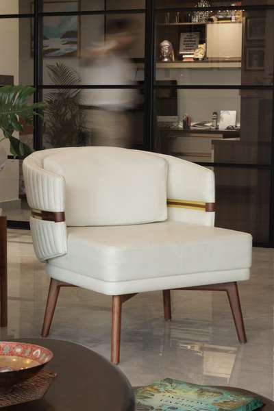This chic chair seamlessly blends modern flair with sophisticated comfort, harmonizing the graceful curves of its backrest with the balanced square seat. The subtle touch of brown introduces a captivating contrast, elevating the off-white tone from monotony. Its captivating design and plush cushions ensure this chair commands attention in any setting.
#ChicComfort #ElegantSeating #GracefulContrast #ModernLuxuryChair #StyleAndComfort #CaptivatingDesign #TimelessElegance #CurvesAndSquares #StatementFurniture #PanachePerfection