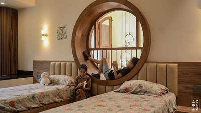 Circular bay-window in kids bedroom 
.
.
Our client's request to highlight the dining area's double height space sparked a creative solution. 

We impulsively proposed a circular bay window, which transformed the space. To incorporate this feature, we rearranged the kids' bedroom layout and interiors.

The bay window proved to be a perfect fit, enhancing the space aesthetically while improving air circulation and facilitating interaction between parents and kids from common areas like the dining and kitchen.

 This design decision successfully merged form and function, elevating the overall ambiance of the space.


#interiordesign #trendingreels #architecture #keralahomedesign #baywindow #kidsroom #modernhome #kidsroomdesign #interiors
